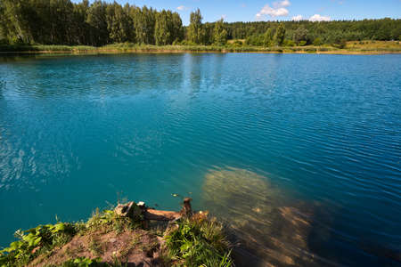 Beautiful lake with blue water in the forest in Russia.の写真素材