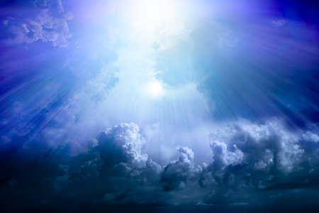 Rays of light through a dramatic sky with clouds. Paradise.の写真素材