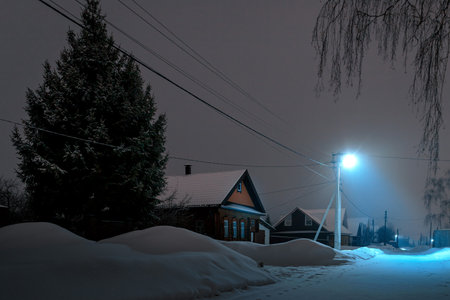 Houses in the Russian village of winter and frosty night.の写真素材