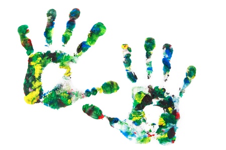 Close up of colored hand print on white background.の写真素材
