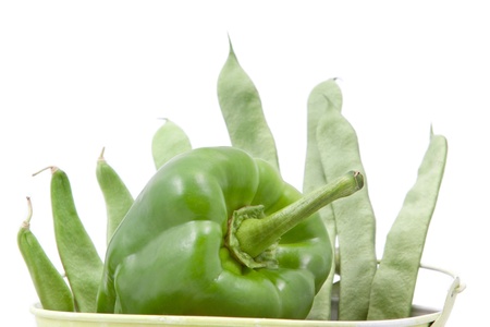 Green beans and peppers in a bucketの写真素材