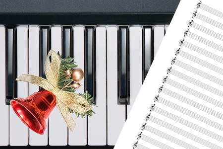 Christmas bell on keyboardの写真素材