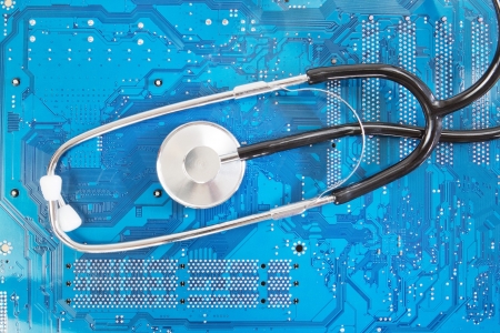 Stethoscope on background motherboard  Diagnostic の写真素材