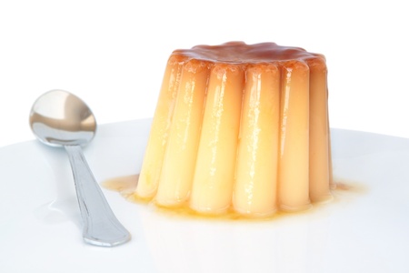 Pudding with caramel on a plate on a white background の写真素材
