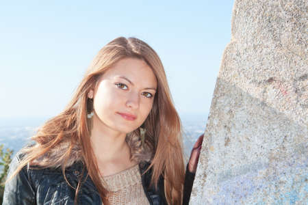 A girl with long hair, against the backdrop of nature.の写真素材