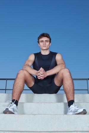 Man athlete resting after exercise の写真素材