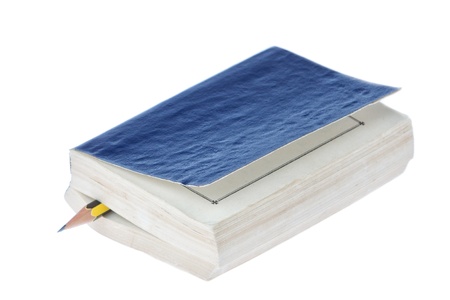 Pencil in a book on a white background.の写真素材