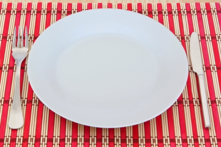 Dining kitchen appliance on a red wicker napkin  On the texture table の写真素材