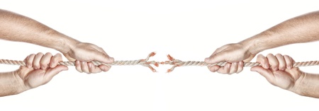Two men break the rope hands competing. On a white background.の写真素材