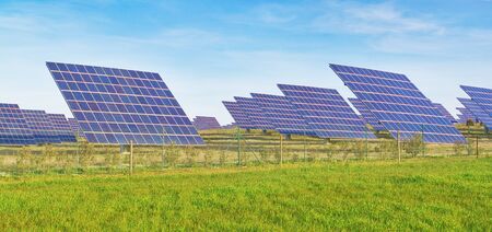 Solar battery panel on the green meadow のeditorial素材