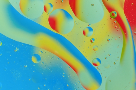Decorative circles form of oil on a colorful background. abstraction.の写真素材