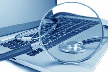 Tools for diagnostics on the laptop. Through a magnifying glass.