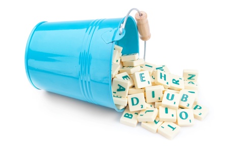 English letters spill out of the bucket. For education.の写真素材