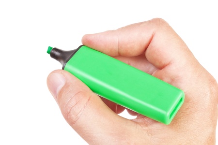 Green felt pen in a male hand for business notes, close-up.