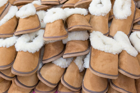 Large group of warm soft slippers for the winter. Close-up.