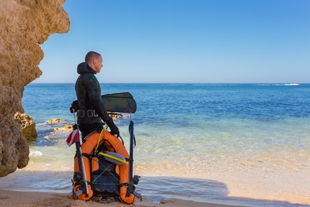 Underwater hunter preparing to dive. Underwater fishing in the Atlantic Ocean.の写真素材