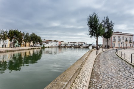 Alley near the river to the center of the town of Tavira.の写真素材