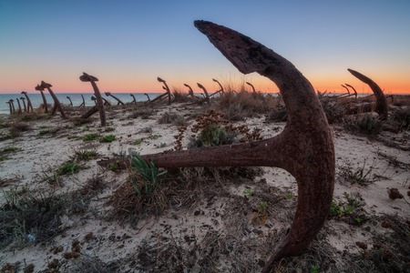 Portuguese beach cemetery anchors. Sunset.