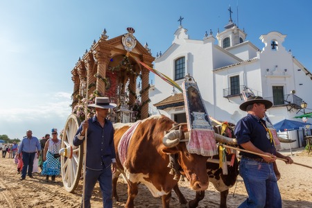 El ROCIO, ANDALUCIA, SPAIN - MAY 22: Romeria with the bulls, after visiting the Sanctuary goes to village.  2015  It is one of the most famous pilgrimage of Spain. This pilgrimage passes from the 15th century.のeditorial素材