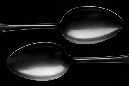 Concept image of outlines spoons. On a black background.の写真素材