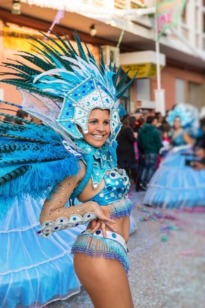 LOULE, PORTUGAL - February 2016: Cheerful carnival Carnaval parade in the city of Loule, Algarve, Portugal. Participants cheer people.のeditorial素材