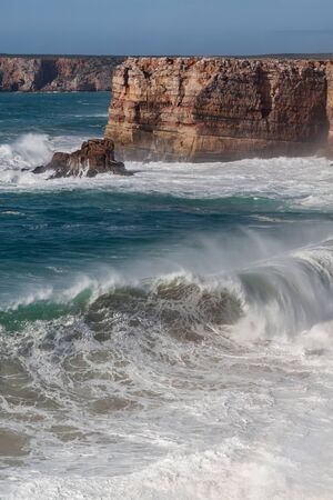 Storm waves beat against the rocks. Sagres in Portugal.の写真素材