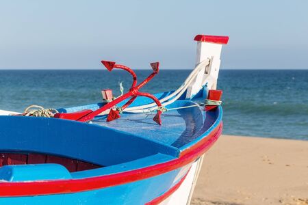 Traditional Portuguese boat on the beach. In Armacao de Pera.の写真素材