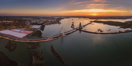 Horizontal view of the river Arade bridge. Sunset. Portugal.の写真素材