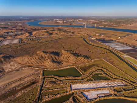 Aerial view of the bridge over the river Guadiana. Salty lake bottom.の写真素材