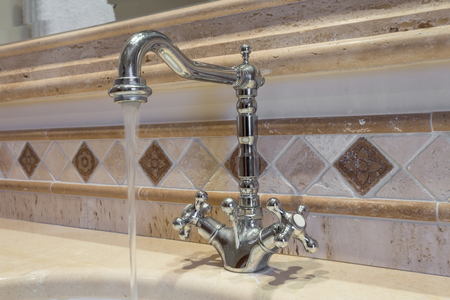 Vintage faucet, in the bathroom with the water.の写真素材