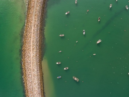 Aerophotography view from above breakwaters boat. Albufeira Marina portの写真素材