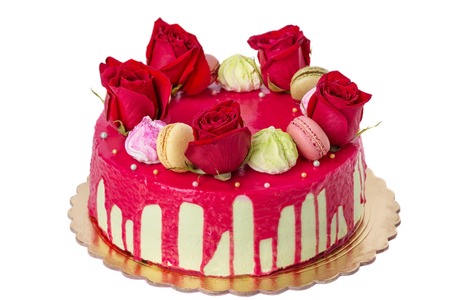 White wedding cake with many red roses