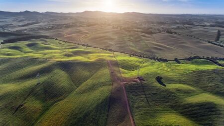 beautiful aerial view from drone. field with sunset sky nature landscape background.の写真素材