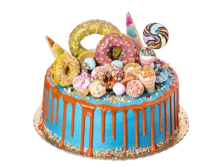 A festive cake made from sweet ornaments on day of birth.