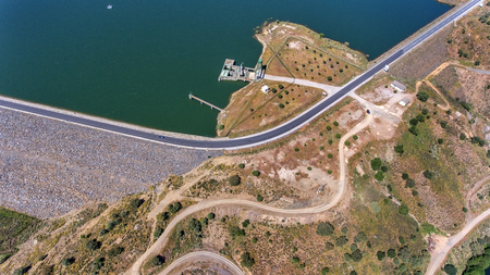 Reservoir of water Odeleite, in the Algarve, road on the dam.の写真素材