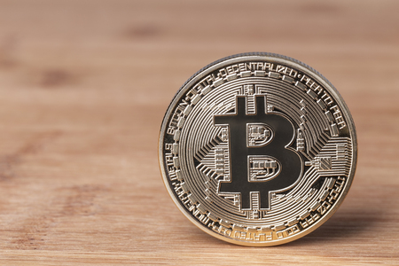 Bitcoin coin on a wooden background. Crypto currency.の写真素材