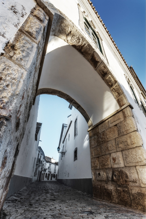 Street of the old town of Faro, unusual angle arches.の写真素材