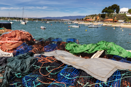 Tackles and traps of fishermen for catching shellfish and fish. In the town of Alvor Algarve.の写真素材