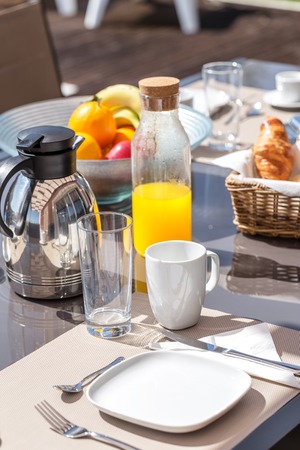 A healthy morning breakfast in yard. In summer.の写真素材