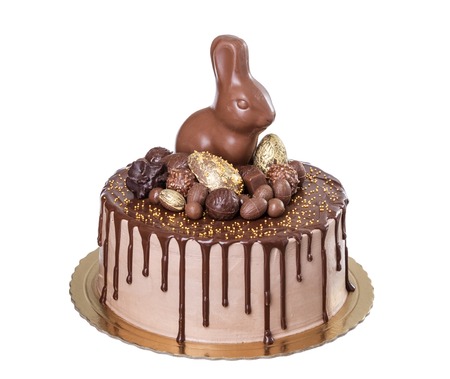 Chocolate cake for Easter with sweets and rabbit.
