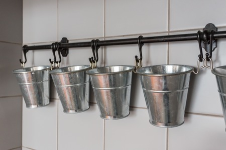 Buckets in the kitchen for the organization of spices and decorations.の写真素材