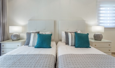 Bedroom in modern style with bed and pillows. Front view.の写真素材