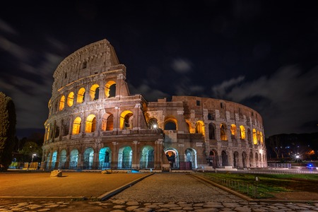 Colosseum architectural structure at night, in Rome.の写真素材