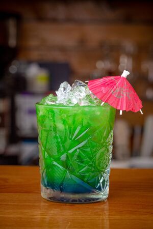 Green mint tonic cocktail, with ice on a barの写真素材