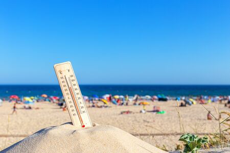 Thermometer for the temperature on the beach, in the summer in the heat. Global warming.の写真素材