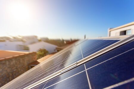 Solar energy storage panels on the roof of a house in a Portuguese city. Clean green energy.