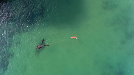 Underwater hunter on the surface of the water while hunting on the Atlantic Sea. Portugal.