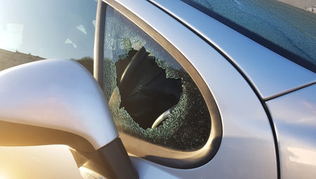 The burglar broke the side window of the car to steal. An example for insurance against robbery
