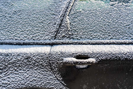 Car covered with ice and icicles after freezing rain. Ice covered car window close up. Bad winter weather, ice stormWinter frosty scenes. High quality photoの写真素材