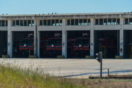 A group of fire trucks parked in the garage and ready to call, to help with a fire. Emergency...